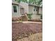 Front entrance with fresh mulch and a wooden stairwell entrance at 6739 Valley Ct, Douglasville, GA 30135