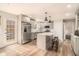 Bright kitchen with island seating, stainless appliances, and modern cabinets at 6739 Valley Ct, Douglasville, GA 30135