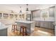 Modern eat-in kitchen with island, stainless appliances, and seating at 6739 Valley Ct, Douglasville, GA 30135