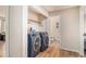 Well-equipped laundry room with modern washer and dryer units, and folding space at 6739 Valley Ct, Douglasville, GA 30135