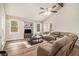 Inviting living room with plush seating, neutral palette, a vaulted ceiling, and plenty of natural light at 6739 Valley Ct, Douglasville, GA 30135
