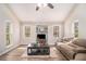 Cozy living room with wood floors, a large sofa and many bright windows at 6739 Valley Ct, Douglasville, GA 30135