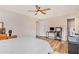 Spacious main bedroom with an overhead fan, ample natural light, and wood flooring at 6739 Valley Ct, Douglasville, GA 30135