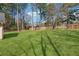 Expansive, well-maintained backyard featuring lush green grass and a wooden fence, perfect for outdoor activities at 140 Double D Rd, Temple, GA 30179