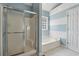 Clean bathroom showcasing shower stall, soaking tub and a bright window at 140 Double D Rd, Temple, GA 30179