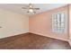 Comfortable bedroom with wood floors, natural light, and a ceiling fan at 140 Double D Rd, Temple, GA 30179