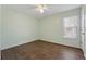 Cozy bedroom with hardwood floors, ceiling fan, and a sunlit window at 140 Double D Rd, Temple, GA 30179