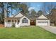 Inviting single-story home with a covered porch, attached garage, and a neatly landscaped front yard at 140 Double D Rd, Temple, GA 30179