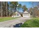 Attractive single-story home with a covered entry, attached garage, and long driveway at 140 Double D Rd, Temple, GA 30179