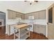 Functional kitchen with a microwave, ample counter space, and a moveable island at 140 Double D Rd, Temple, GA 30179