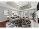 Bright living room boasts hardwood floors, tray ceilings, and ample natural light at 140 Double D Rd, Temple, GA 30179