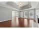 Open-concept living room with fireplace and hardwood floors at 140 Double D Rd, Temple, GA 30179