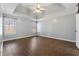 Bright main bedroom with wood floors, tray ceiling, and ample natural light at 140 Double D Rd, Temple, GA 30179