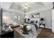 Relaxing main bedroom with natural light, tray ceilings, and wood floors at 140 Double D Rd, Temple, GA 30179