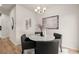 Dining room features a round table with grey chairs, chandelier, and wall art at 58 Leggett Dr # 186, Villa Rica, GA 30180