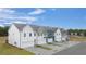 View of newly constructed townhomes featuring modern exteriors, private garages, and well-maintained landscaping at 58 Leggett Dr # 186, Villa Rica, GA 30180