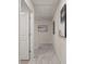 Well-lit hallway featuring stylish artwork and neutral carpeting at 58 Leggett Dr # 186, Villa Rica, GA 30180