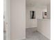 Hallway with carpet, half wall, neutral paint and decorative artwork at 58 Leggett Dr # 186, Villa Rica, GA 30180