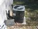 Outdoor AC unit providing efficient cooling for comfortable indoor living, and is situated near foliage at 123 Oldenburg Dr, Riverdale, GA 30274