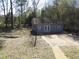 A view of the back exterior and backyard, which includes a back deck, yard and an outbuilding at 123 Oldenburg Dr, Riverdale, GA 30274