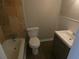 The bathroom features a tiled shower/tub, modern fixtures, and a vanity with storage space at 123 Oldenburg Dr, Riverdale, GA 30274