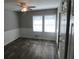 Bedroom with new vinyl floors, fresh paint, and natural light, creating a serene and inviting space at 123 Oldenburg Dr, Riverdale, GA 30274