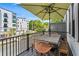 Outdoor balcony with a dining table and seating overlooking the neighborhood at 215 Arizona Ne Ave # 1, Atlanta, GA 30307
