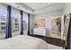 Spacious bedroom with a tray ceiling, large windows, and an ensuite bathroom at 215 Arizona Ne Ave # 1, Atlanta, GA 30307