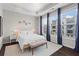 Bright bedroom with ample natural light, a tray ceiling, and a comfortable bed at 215 Arizona Ne Ave # 1, Atlanta, GA 30307