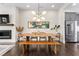 Airy dining area features fireplace, modern lighting, and is open to the kitchen at 215 Arizona Ne Ave # 1, Atlanta, GA 30307