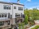 Townhome with private balcony, stairs and manicured landscaping, offering a stylish and inviting exterior at 215 Arizona Ne Ave # 1, Atlanta, GA 30307