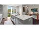 Spacious kitchen with a quartz countertop island, stainless steel appliances and plenty of natural light at 215 Arizona Ne Ave # 1, Atlanta, GA 30307