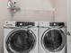 Laundry room featuring a modern, front-load washer and dryer set for convenient laundry care at 215 Arizona Ne Ave # 1, Atlanta, GA 30307