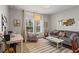 Inviting living room with comfortable seating, a decorative mirror, and plenty of natural light at 215 Arizona Ne Ave # 1, Atlanta, GA 30307