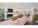 Open-concept living room featuring a fireplace, modern lighting, and hardwood floors throughout at 215 Arizona Ne Ave # 1, Atlanta, GA 30307