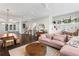 Bright living room with a modern chandelier, hardwood floors, and access to the kitchen at 215 Arizona Ne Ave # 1, Atlanta, GA 30307