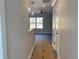 Hallway features modern lighting, neutral paint, and flooring leading to a living area at 229 Evergreen Trail Unit C, Cartersville, GA 30121