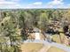 An aerial shot of the home nestled among mature trees in a quiet and secluded neighborhood at 3435 Stallion Ct, Powder Springs, GA 30127