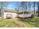 The house features a large yard with a screened in porch, making the space excellent for entertaining at 3435 Stallion Ct, Powder Springs, GA 30127