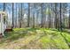 The large backyard features mature trees and provides lots of space for outdoor activities at 3435 Stallion Ct, Powder Springs, GA 30127