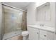 Bathroom with a tiled walk-in shower, white vanity, and modern fixtures at 3435 Stallion Ct, Powder Springs, GA 30127