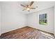 Bedroom with hardwood floors, ceiling fan, and view of outside at 3435 Stallion Ct, Powder Springs, GA 30127