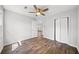 Bright bedroom featuring wood-look floors, closet, and a ceiling fan at 3435 Stallion Ct, Powder Springs, GA 30127