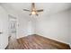 Cozy bedroom features wood-look floors, ceiling fan, and two closets at 3435 Stallion Ct, Powder Springs, GA 30127
