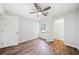 Bright bedroom with hardwood floors, a window, and closet at 3435 Stallion Ct, Powder Springs, GA 30127