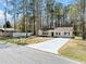 Charming single story home with a paved driveway and well maintained landscaping in a wooded neighborhood at 3435 Stallion Ct, Powder Springs, GA 30127