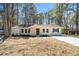 Charming single story home with a covered porch, neat landscaping, and a paved driveway at 3435 Stallion Ct, Powder Springs, GA 30127