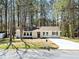 Charming one-story home with a fresh exterior, new driveway, and well-maintained lawn at 3435 Stallion Ct, Powder Springs, GA 30127