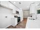 Bright kitchen with white cabinetry, stainless steel appliances, hardwood floors and lots of natural light at 3435 Stallion Ct, Powder Springs, GA 30127