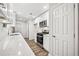 Stylish kitchen boasting white cabinets, stainless steel appliances, and modern countertops at 3435 Stallion Ct, Powder Springs, GA 30127